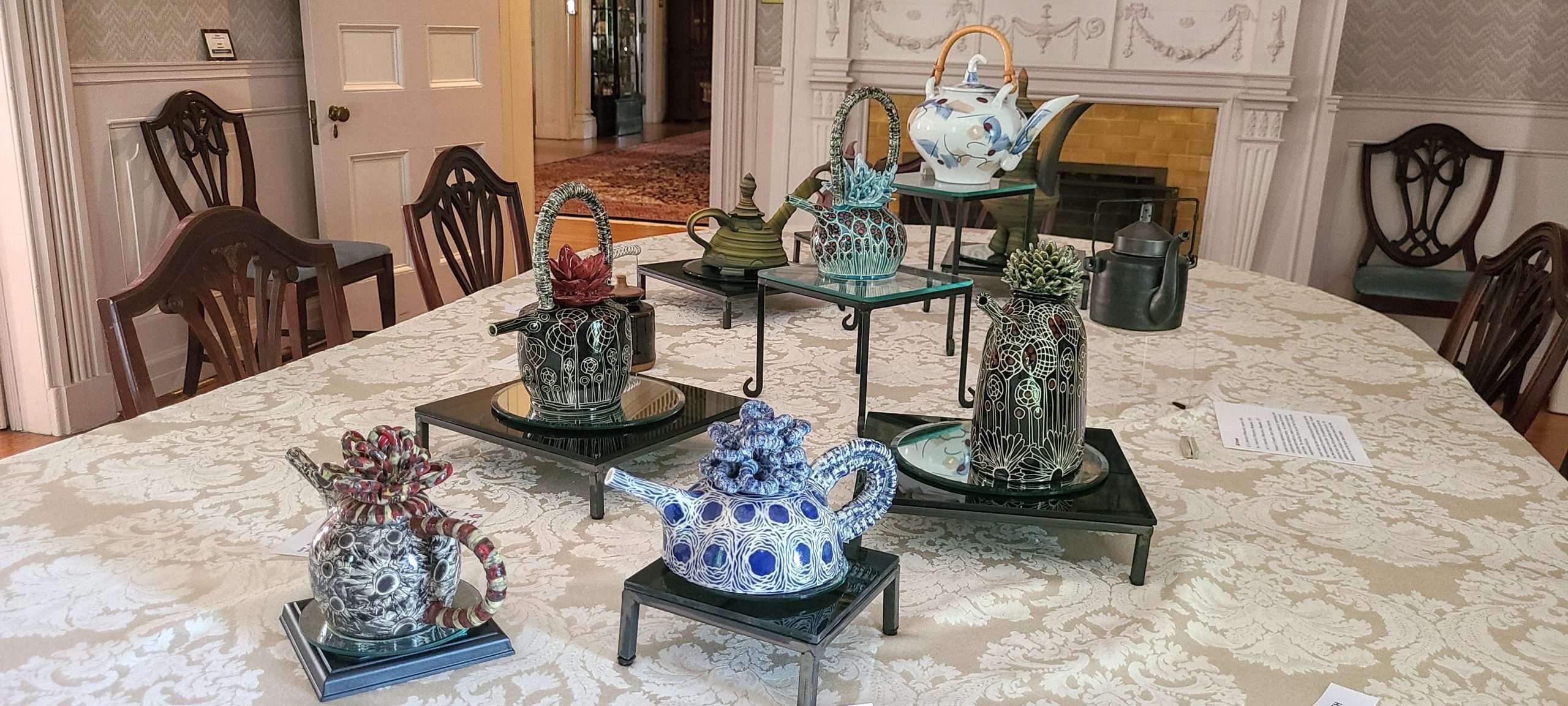 Teapots on display in the dining room during the "Art of Teapots" exhibit